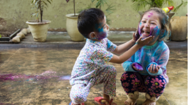 Image of two kids playing and making a mess.