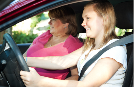 Mom teaching daughter how to drive