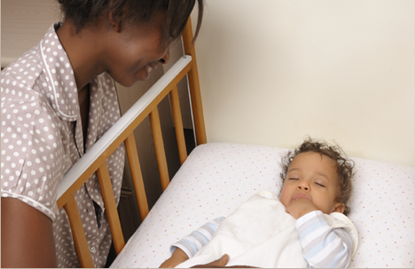 Mom watching a child sleeping