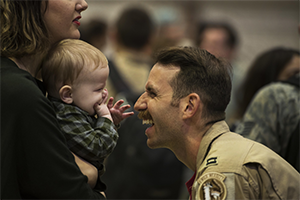 Dad and a child looking at each other