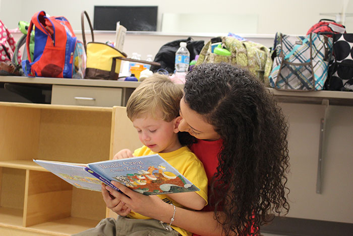 Mother reading with daughter